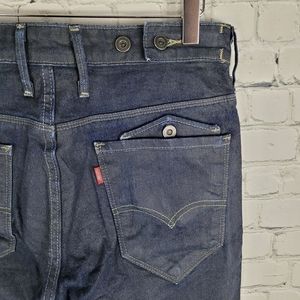 LEVI'S | 717 coated denim slim leg dark wash jeans